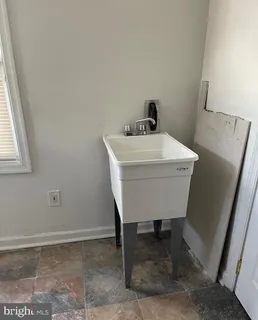 a room with a table and chairs