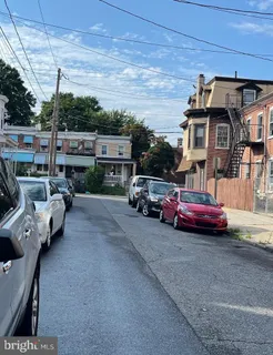 a view of street with parked cars