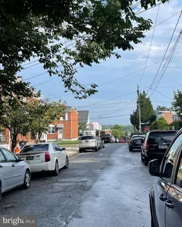 a view of a cars park in front of a house