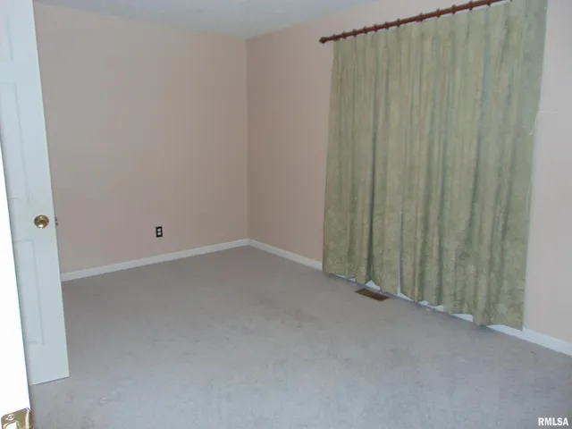 a view of a room with an entryway