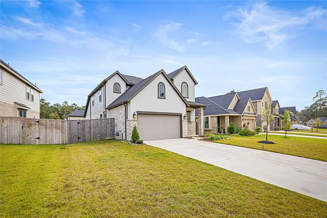 a view of a house next to a big yard