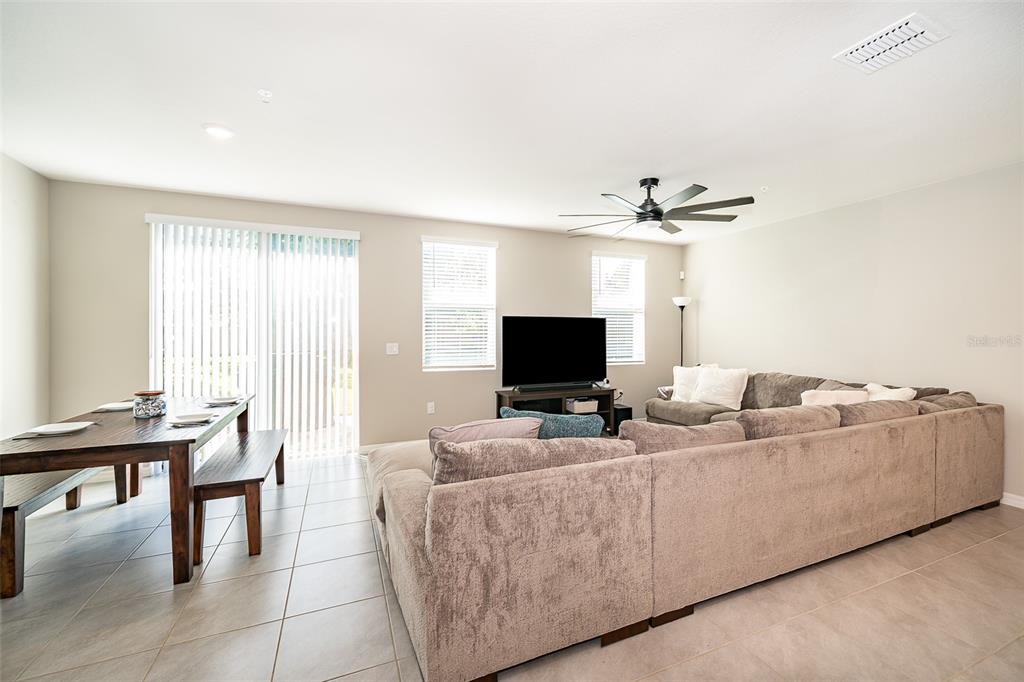 2555 Sweet Viburnum Way Ocoee, FL 34761 - Photo 14 of 26 a living room with furniture and a flat screen tv