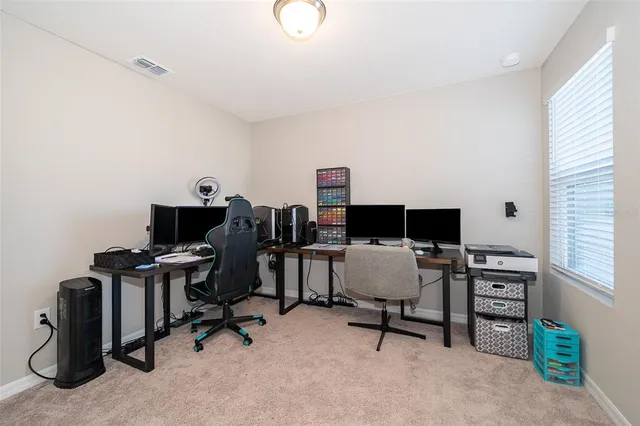 a view of a workspace with furniture