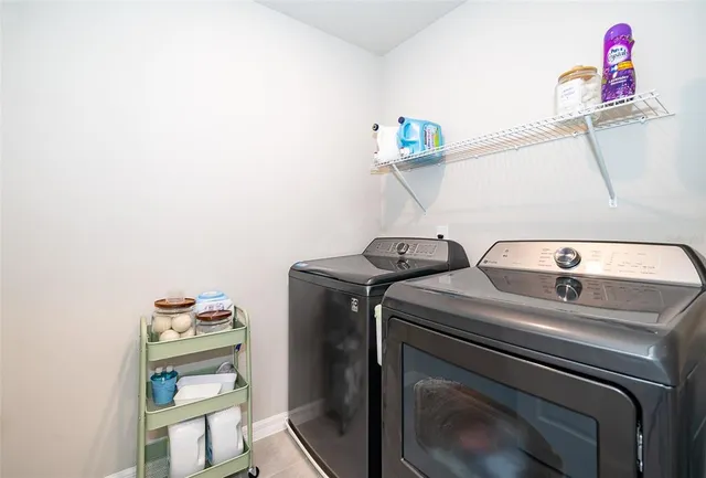 a utility room with dryer and washer