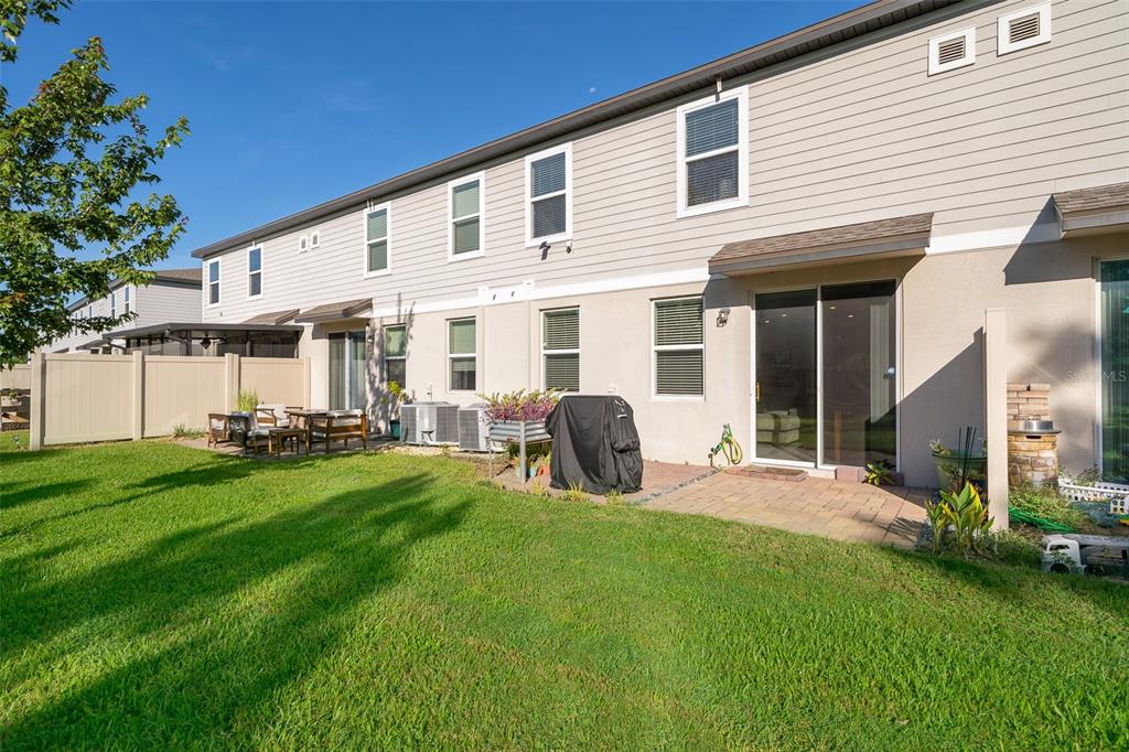 2555 Sweet Viburnum Way Ocoee, FL 34761 - Photo 23 of 26 a view of a house with backyard and porch