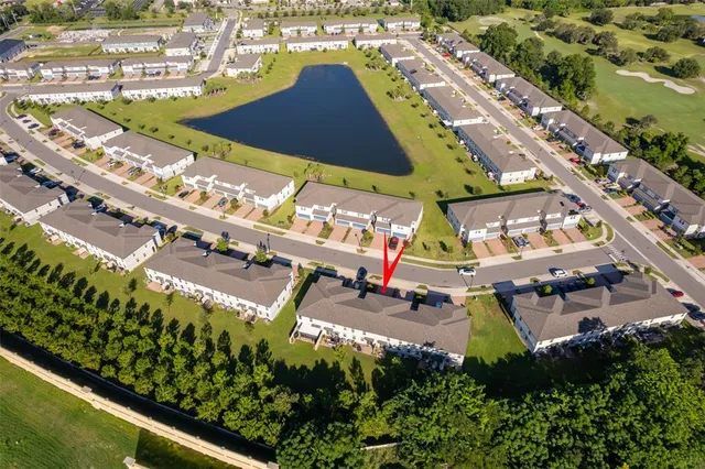 an aerial view of a swimming pool patio and outdoor seating