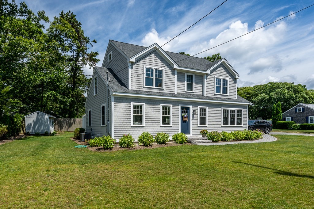180 Lower County Road West Harwich, MA 02671 - Photo 18 of 18 a front view of house with yard and green space