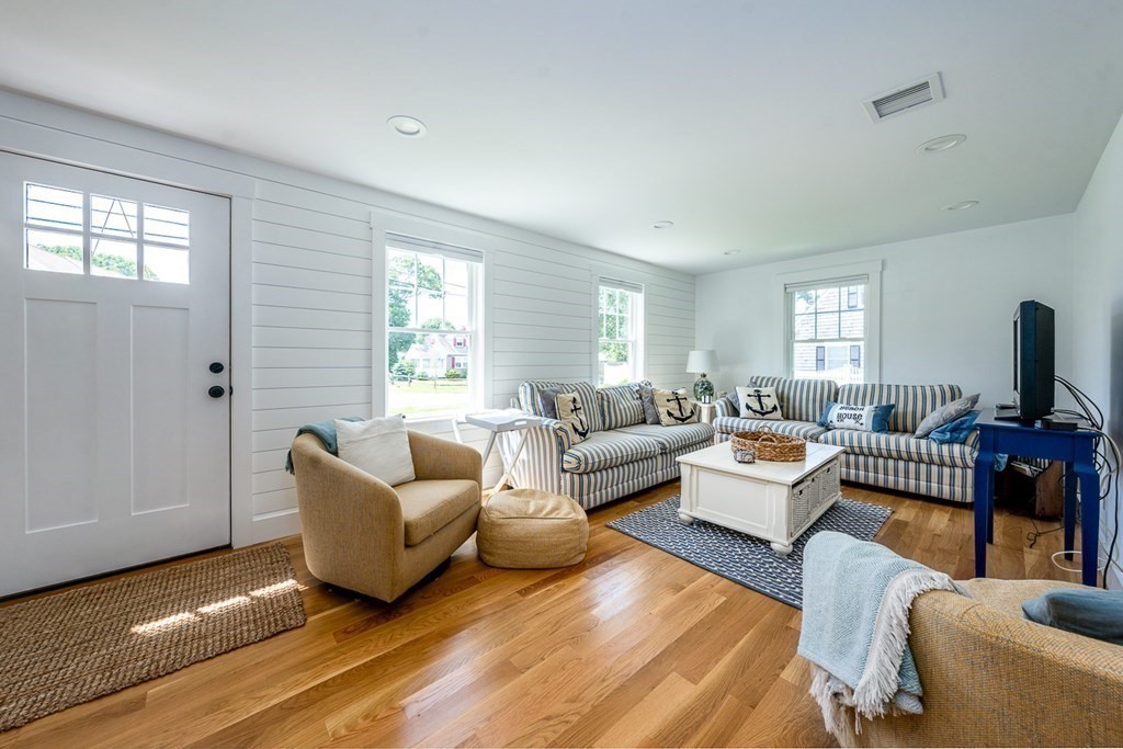 180 Lower County Road West Harwich, MA 02671 - Photo 4 of 18 a living room with furniture and windows