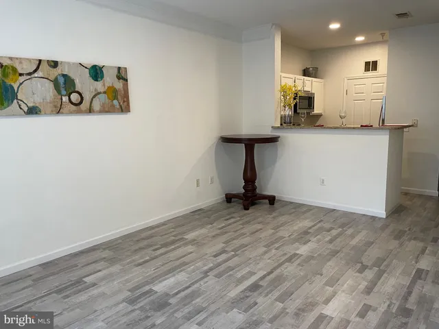 a view of a kitchen with a sink and a window
