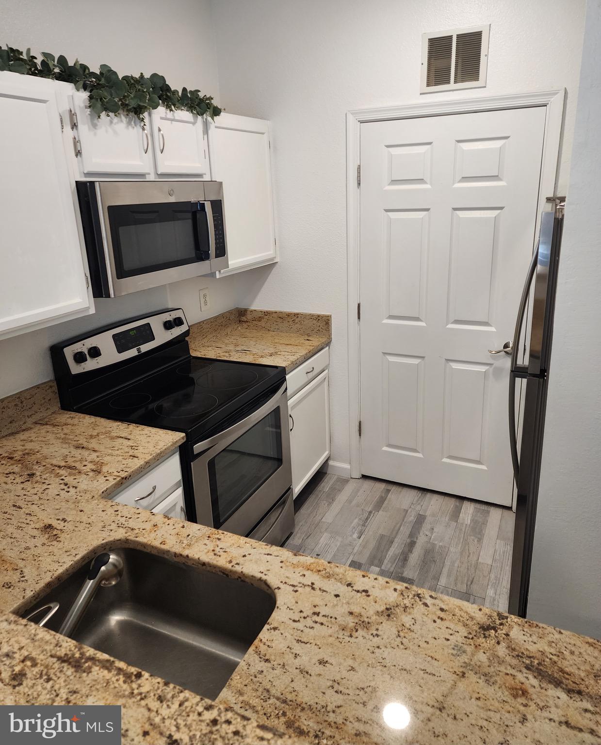 1521 Spring Gate Dr., Unit 10102 McLean, VA 22102 - Photo 14 of 46 Door to onsite washer/dryer