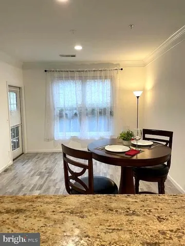 a view of a living room and kitchen