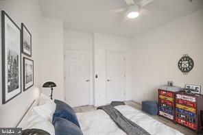 1521 Spring Gate Dr., Unit 10102 McLean, VA 22102 - Photo 19 of 46 a bedroom with a bed and a chandelier