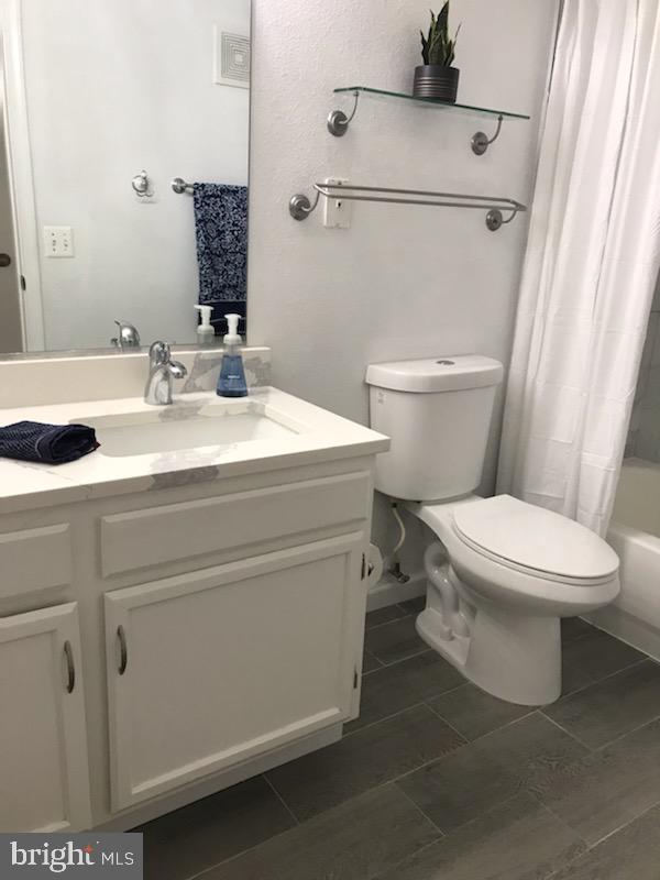 1521 Spring Gate Dr., Unit 10102 McLean, VA 22102 - Photo 20 of 46 a white toilet sitting next to a bathroom sink