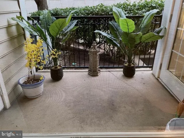 a view of a fountain in front of a brick building