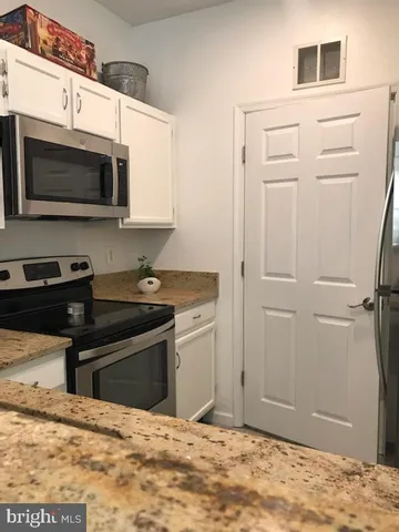 a swimming pool with outdoor seating and yard