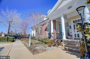 1521 Spring Gate Dr., Unit 10102 McLean, VA 22102 - Photo 39 of 46 a row of palm trees in front of a building