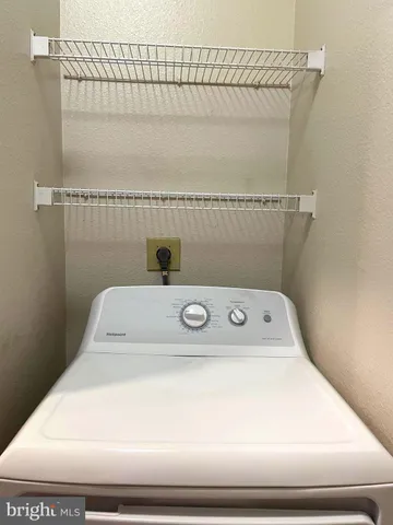 a utility room with a dryer and washer