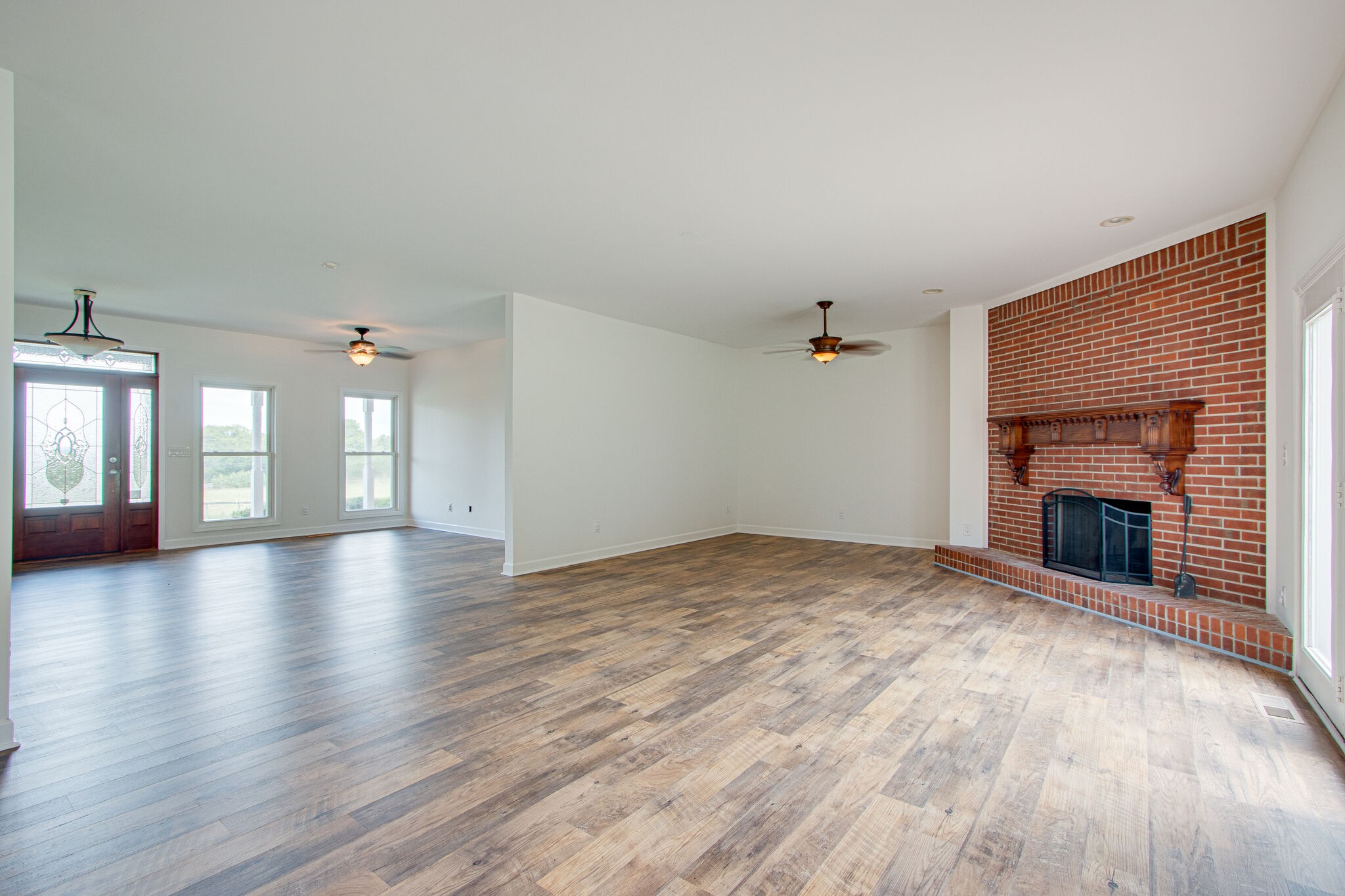 1950 Carpenter Bridge Road Columbia, TN 38401 - Photo 11 of 50 an empty room with windows and fireplace