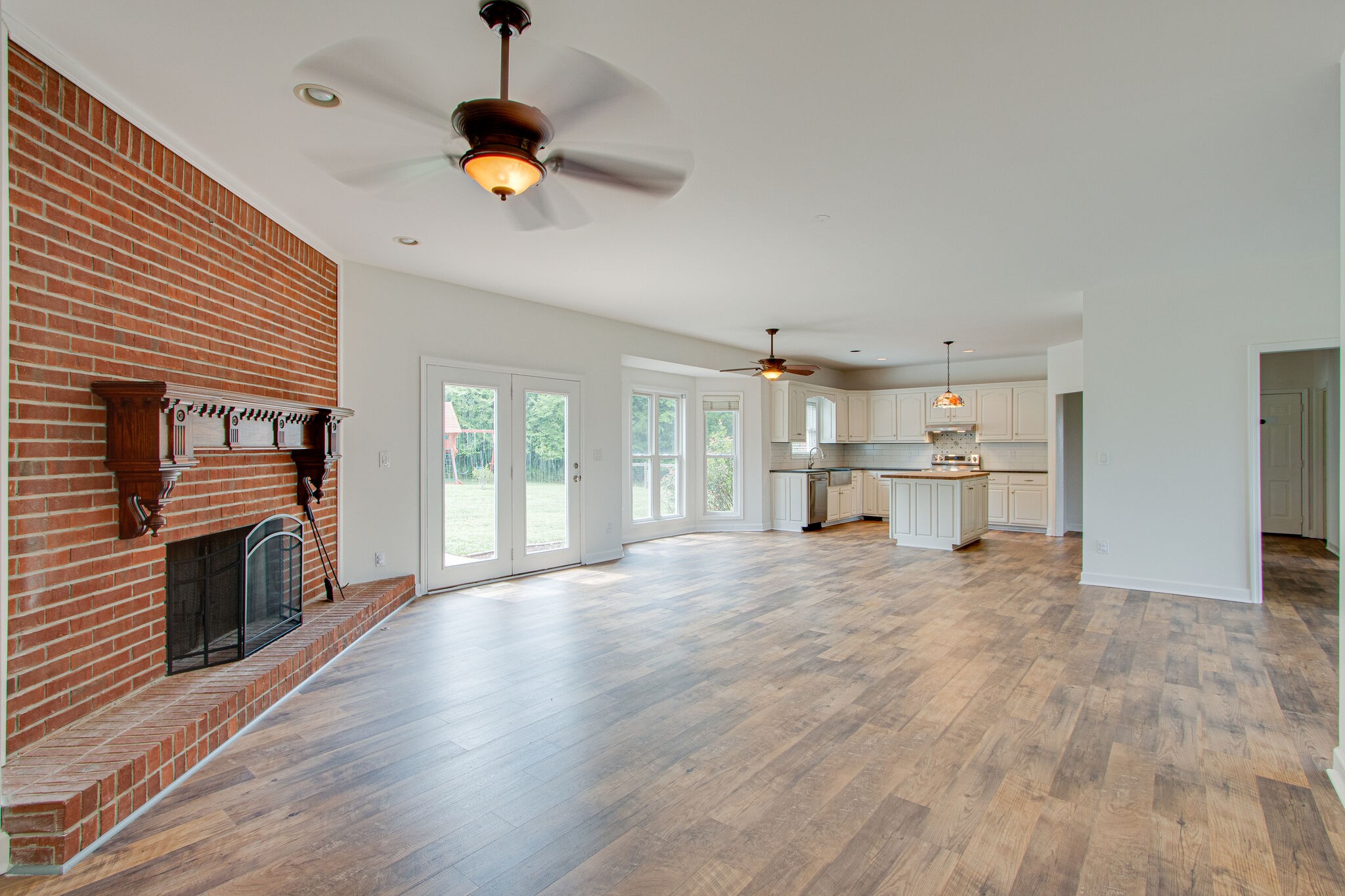 1950 Carpenter Bridge Road Columbia, TN 38401 - Photo 12 of 50 a view of empty room with wooden floor and fireplace
