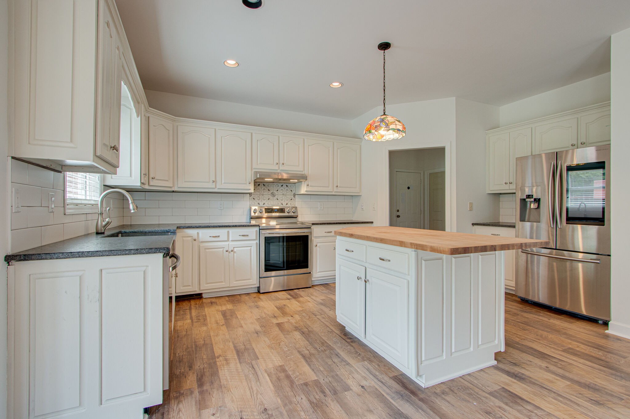1950 Carpenter Bridge Road Columbia, TN 38401 - Photo 16 of 50 a kitchen with stove a sink and refrigerator