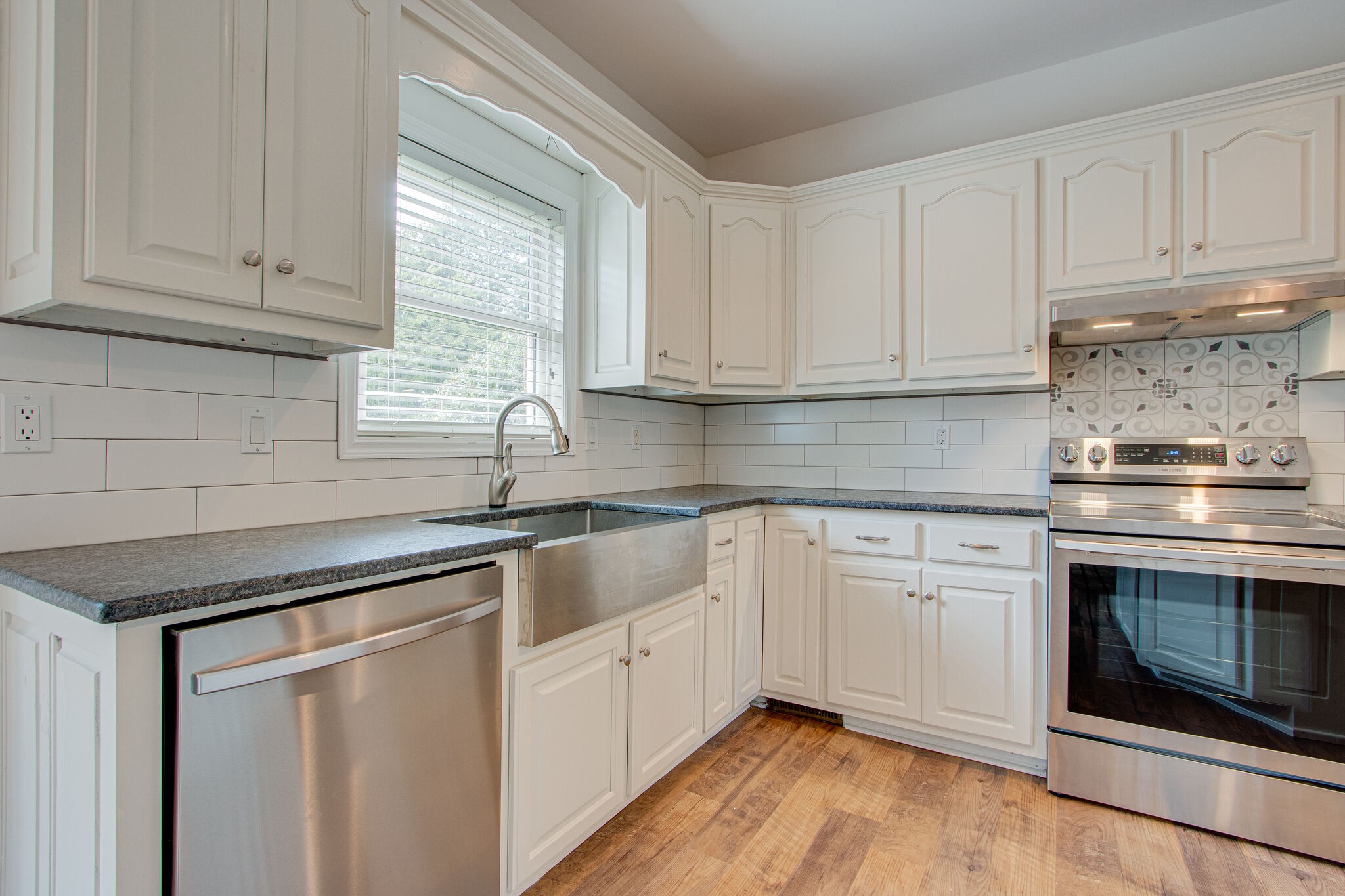1950 Carpenter Bridge Road Columbia, TN 38401 - Photo 17 of 50 a kitchen with granite countertop white cabinets and white appliances