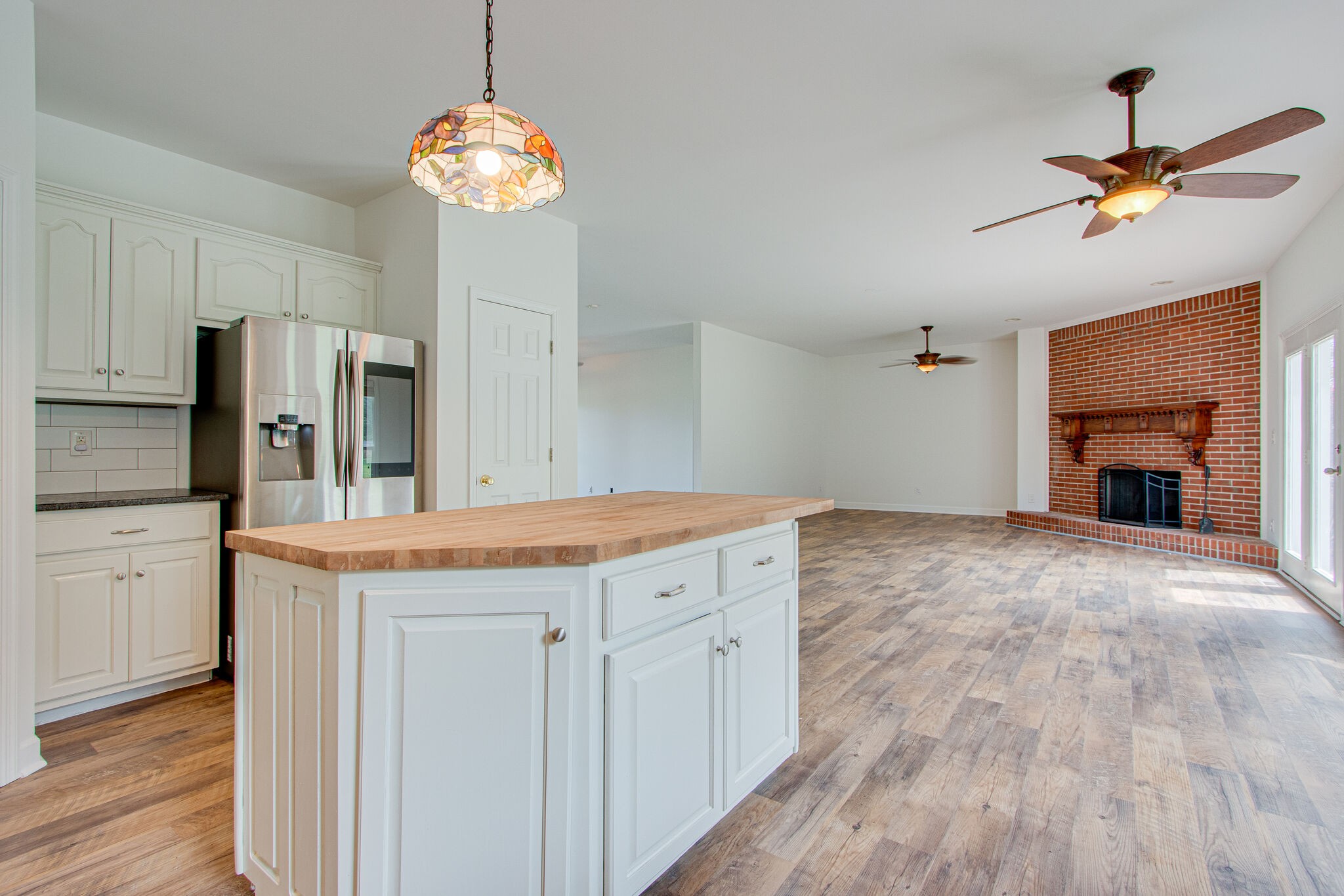 1950 Carpenter Bridge Road Columbia, TN 38401 - Photo 18 of 50 a kitchen with kitchen island white cabinets and stainless steel appliances