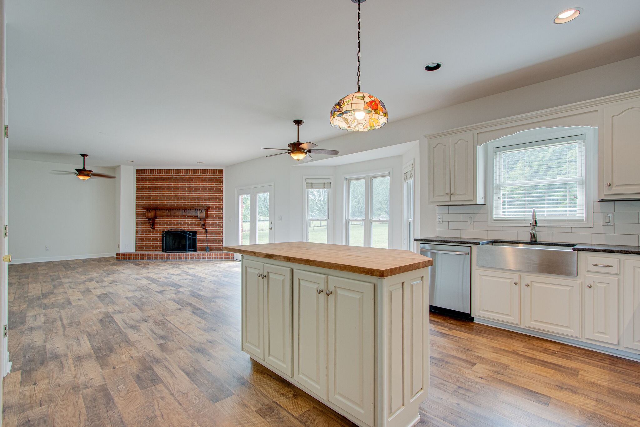 1950 Carpenter Bridge Road Columbia, TN 38401 - Photo 20 of 50 a view of a kitchen with a sink dishwasher and wooden floor