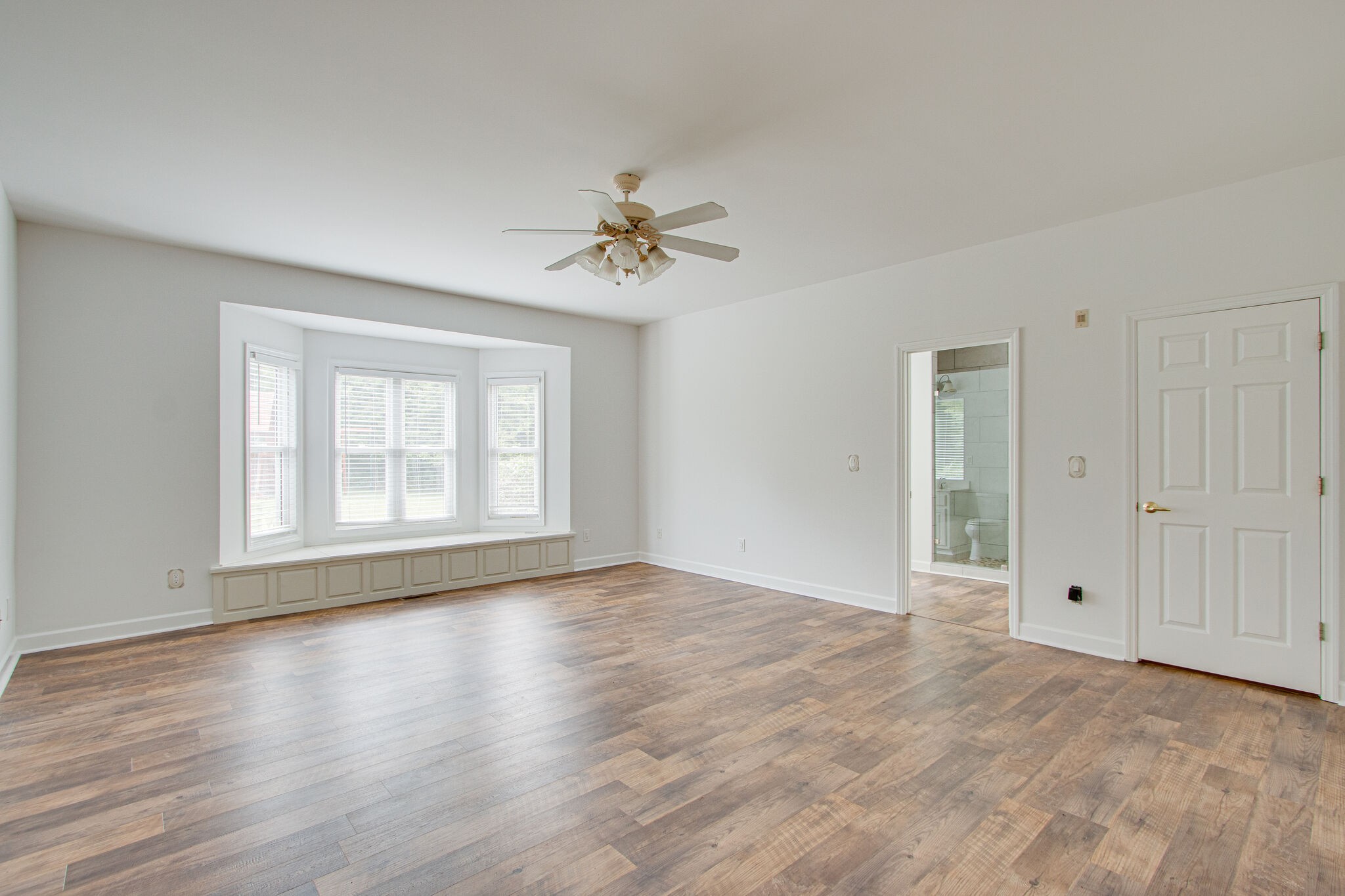 1950 Carpenter Bridge Road Columbia, TN 38401 - Photo 21 of 50 a view of an empty room with a window and wooden floor