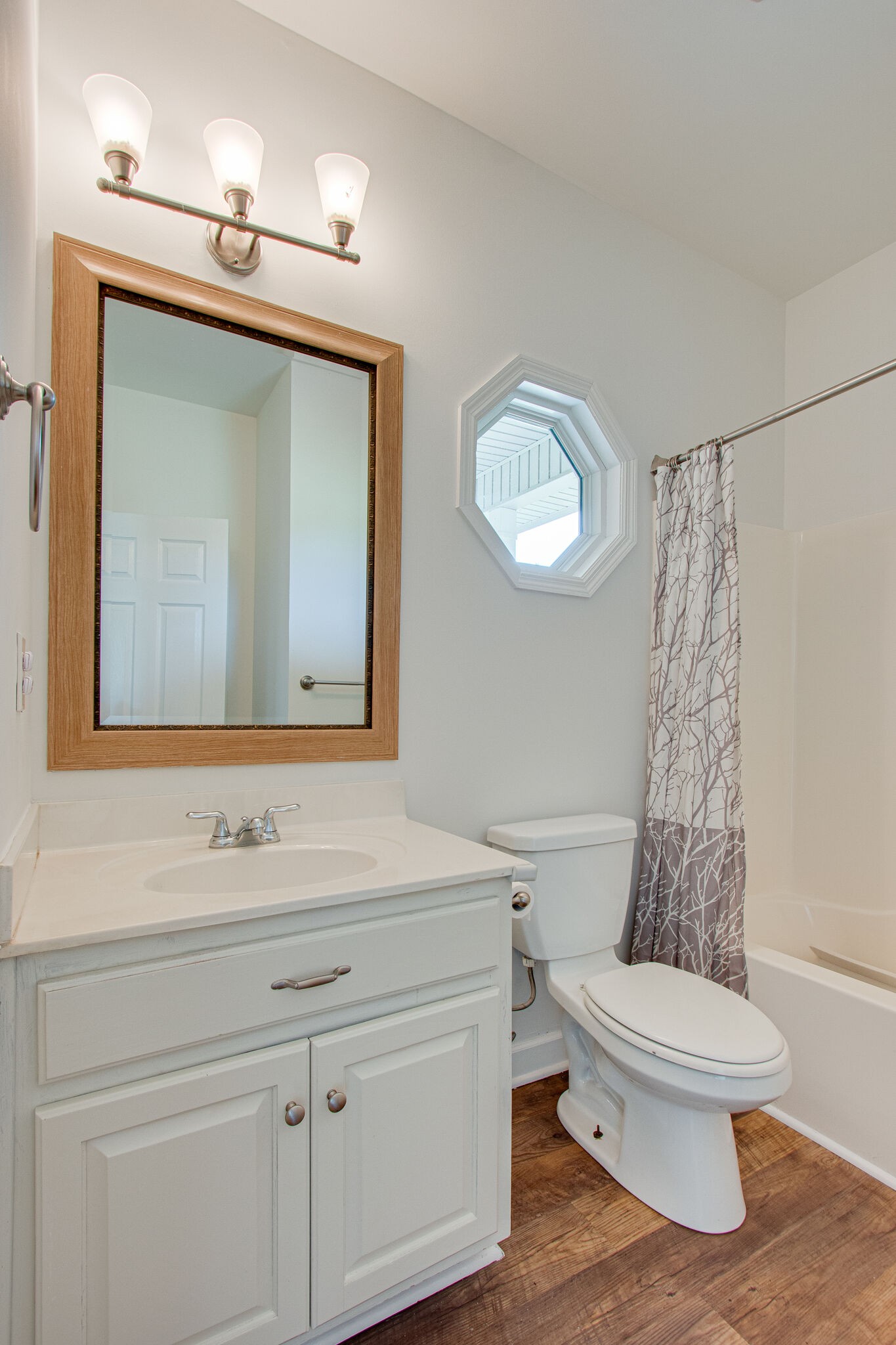 1950 Carpenter Bridge Road Columbia, TN 38401 - Photo 34 of 50 a bathroom with a toilet a sink and mirror