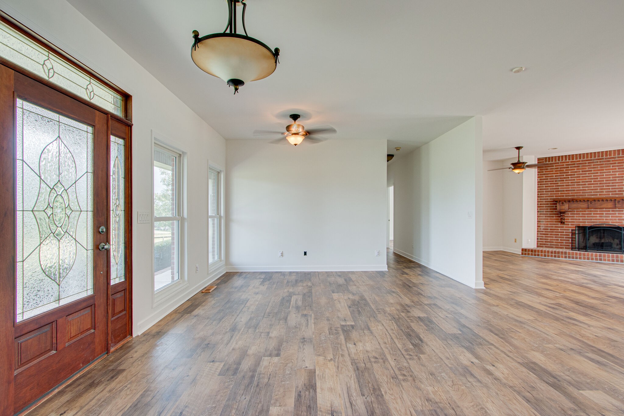 1950 Carpenter Bridge Road Columbia, TN 38401 - Photo 5 of 50 a view of a livingroom with wooden floor and a ceiling fan