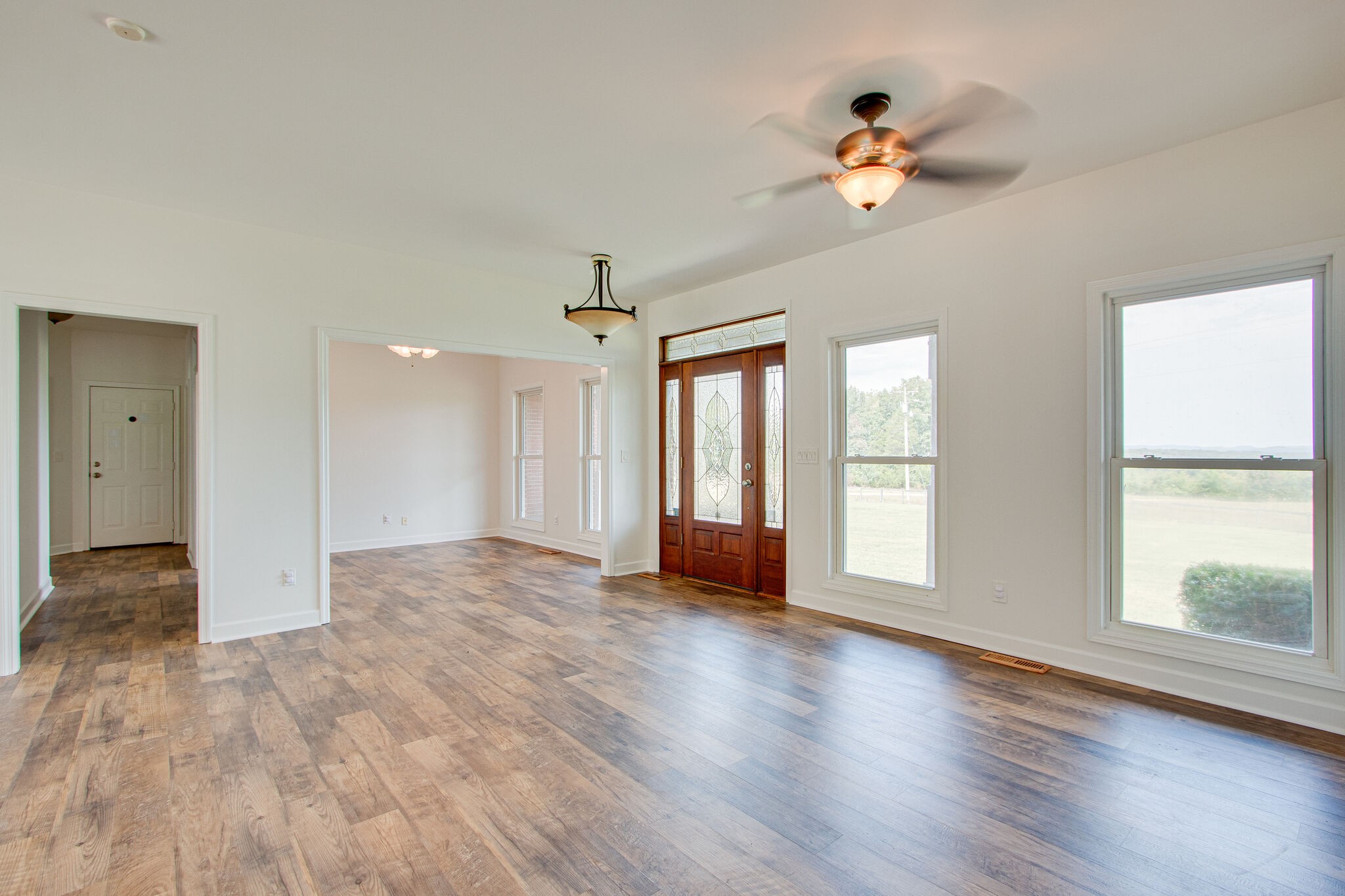 1950 Carpenter Bridge Road Columbia, TN 38401 - Photo 6 of 50 a view of an empty room with a window and wooden floor