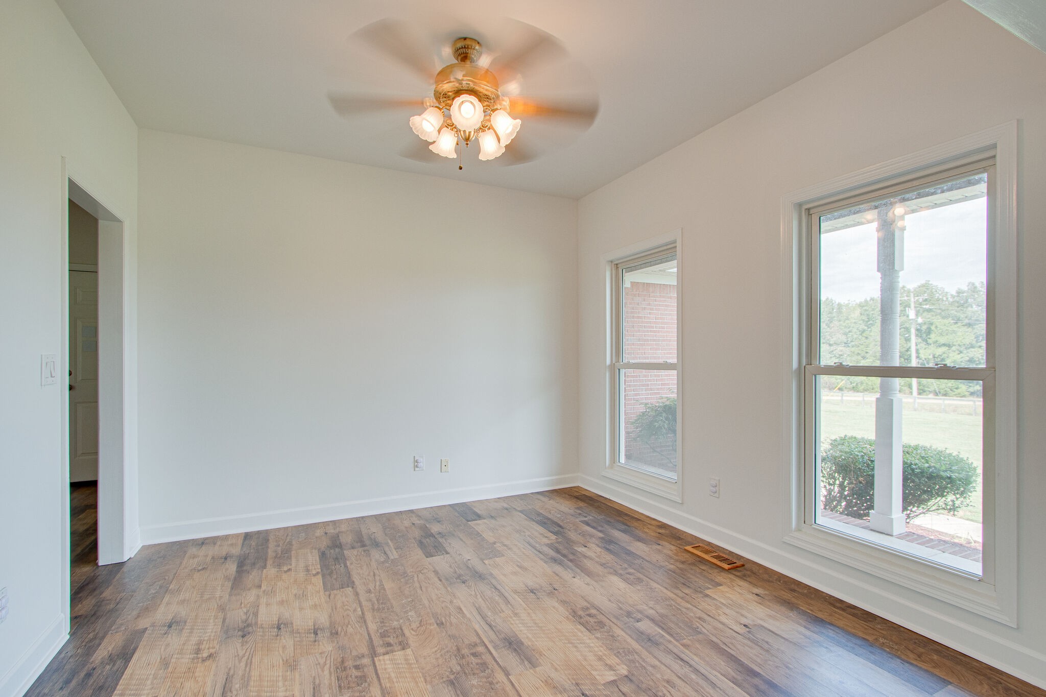 1950 Carpenter Bridge Road Columbia, TN 38401 - Photo 7 of 50 wooden floor in an empty room with a window