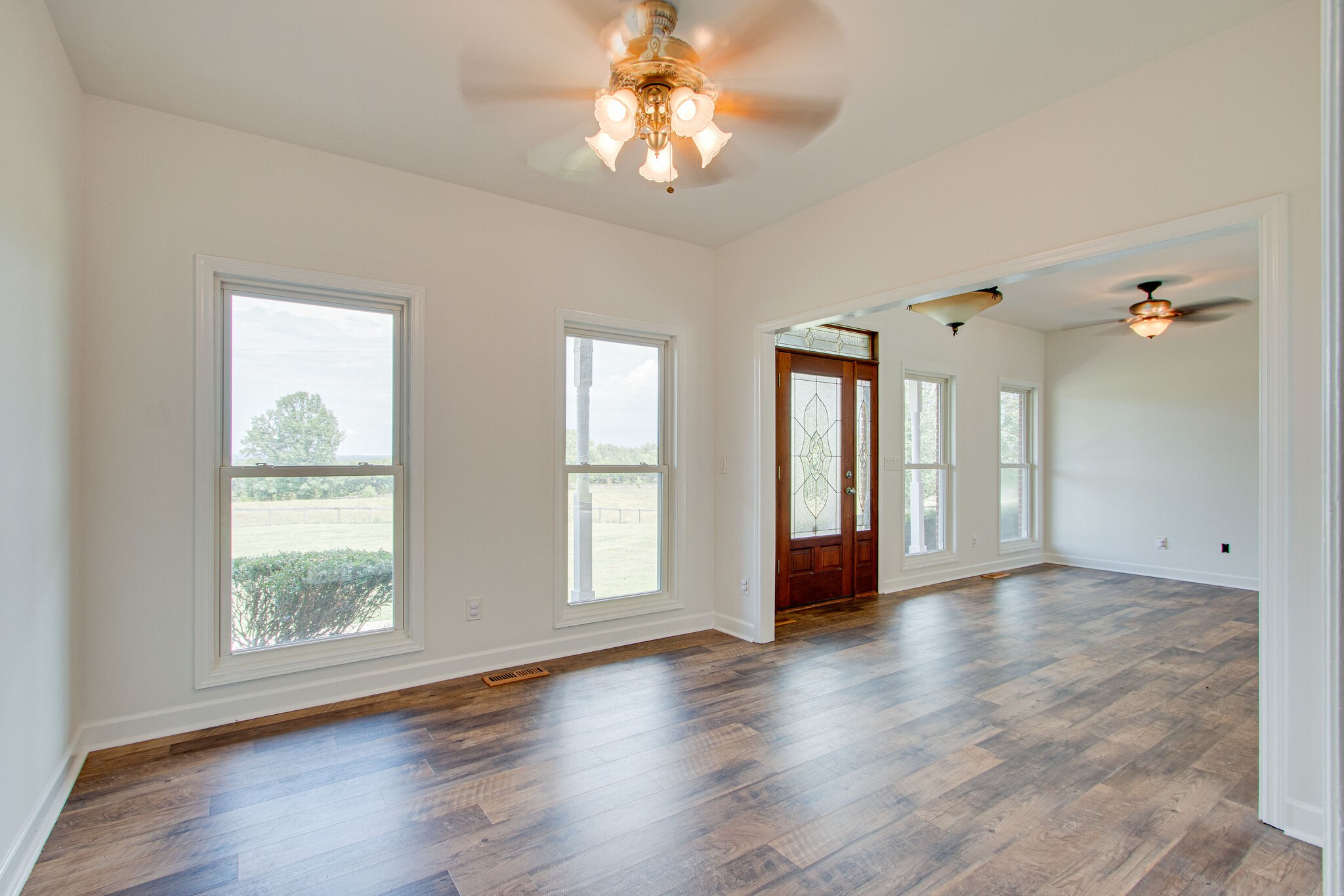 1950 Carpenter Bridge Road Columbia, TN 38401 - Photo 8 of 50 a view of an empty room with a window and wooden floor