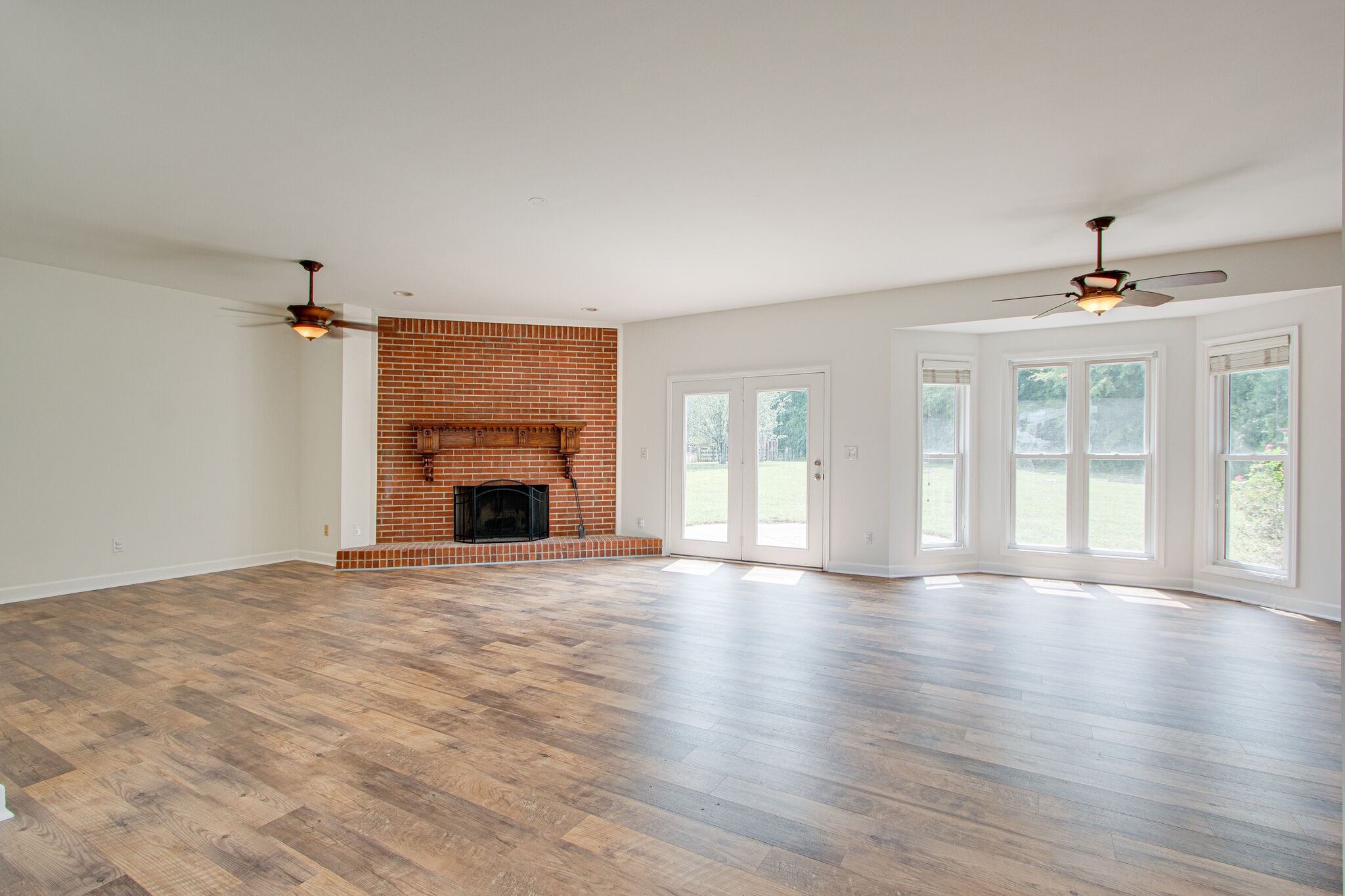 1950 Carpenter Bridge Road Columbia, TN 38401 - Photo 9 of 50 a view of an empty room with a fireplace and a window