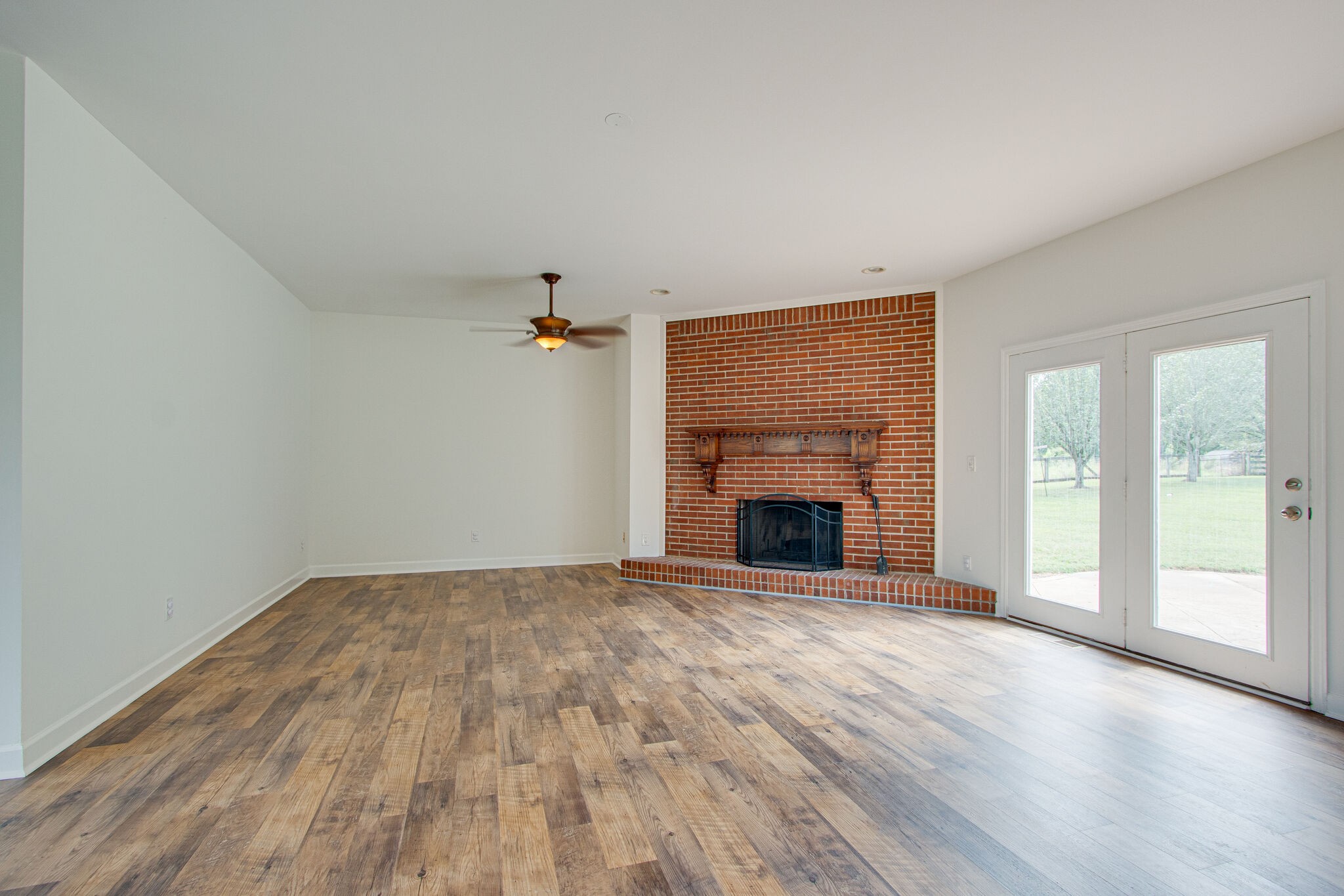 1950 Carpenter Bridge Road Columbia, TN 38401 - Photo 10 of 50 wooden floor fireplace and natural light in room