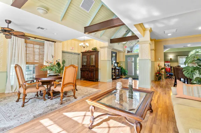 a dining space with furniture and wooden floor