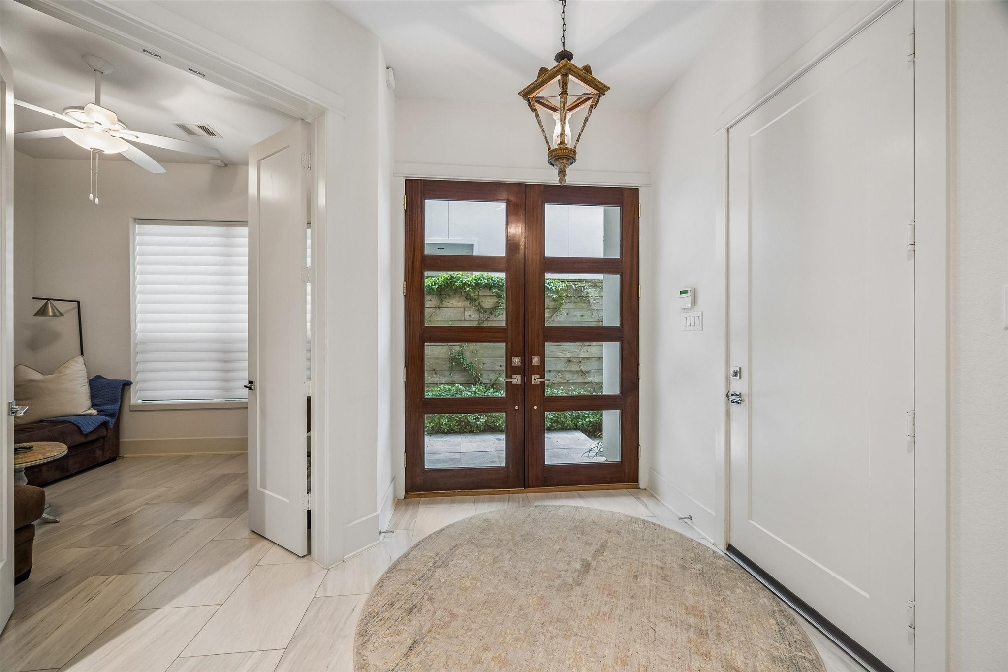 1526 Vermont Street Houston, TX 77006 - Photo 5 of 39 Light-filled foyer with clean lines and elegant finishes.