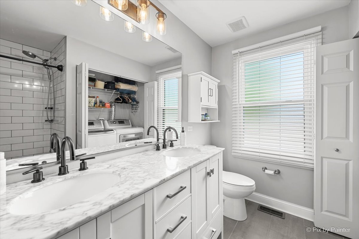 1150 Appleton Lane Geneva, IL 60134 - Photo 16 of 43 a bathroom with a granite countertop sink toilet a large mirror and shower
