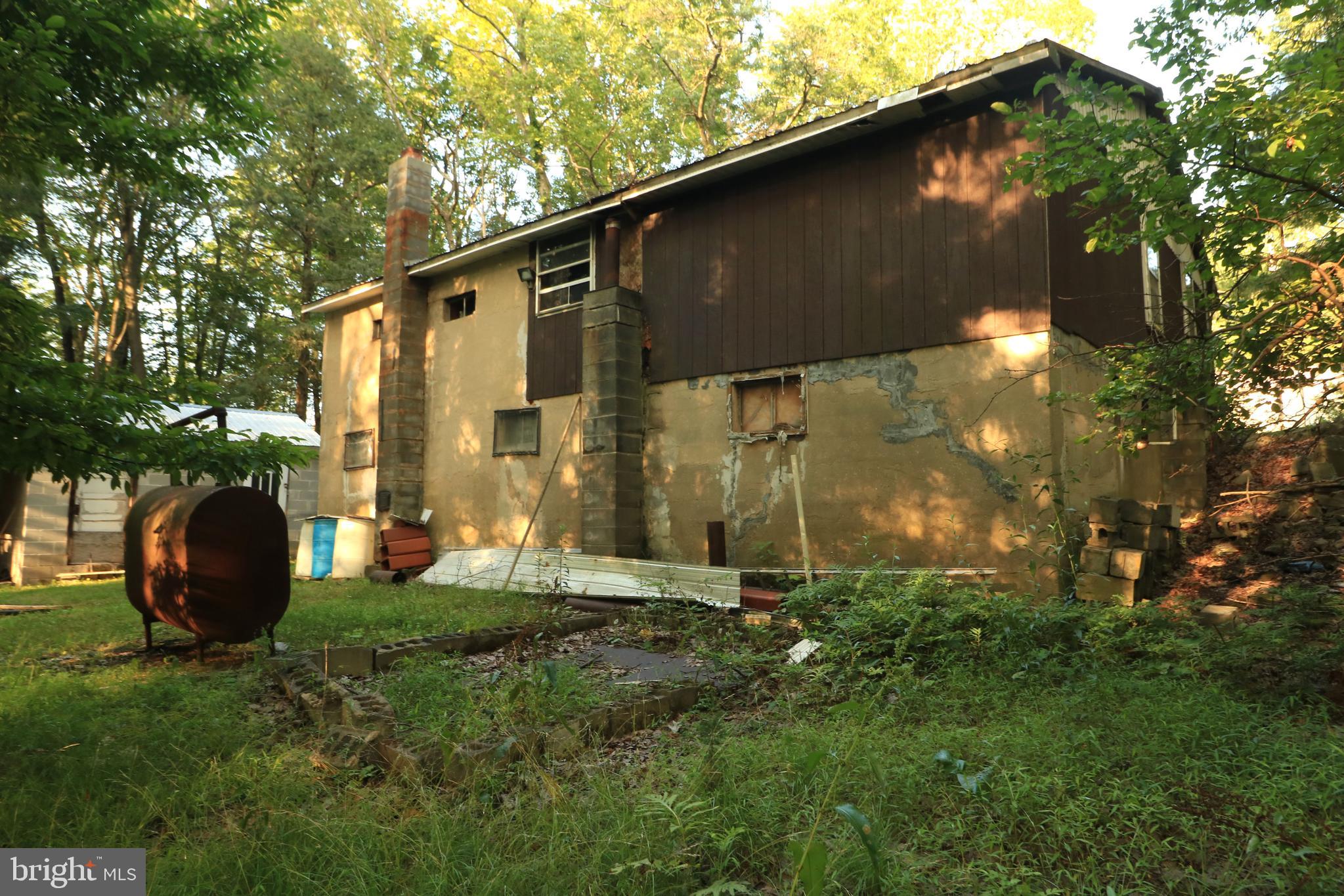 313 Greens Valley Road Centre Hall, PA 16828 - Photo 11 of 11 a backyard of a house with lots of green space