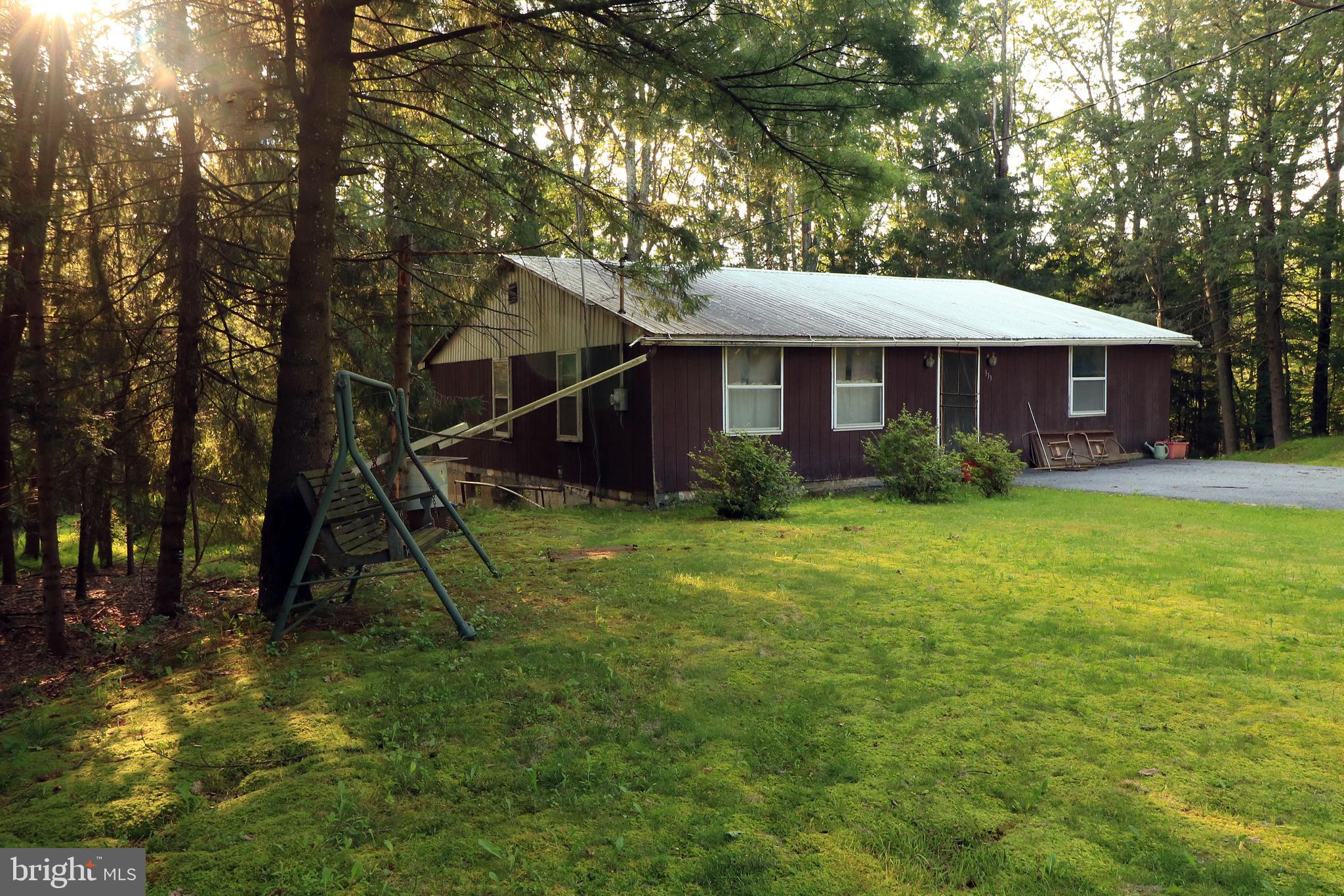 313 Greens Valley Road Centre Hall, PA 16828 - Photo 3 of 11 a view of a house with a backyard