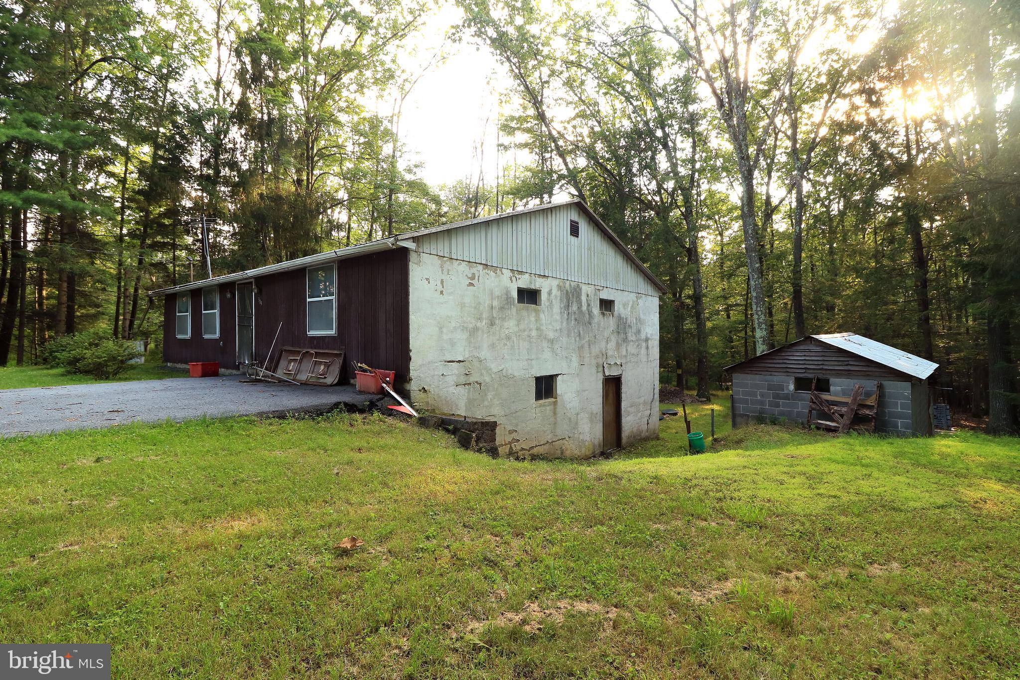 313 Greens Valley Road Centre Hall, PA 16828 - Photo 6 of 11 a view of a house with backyard and sitting area