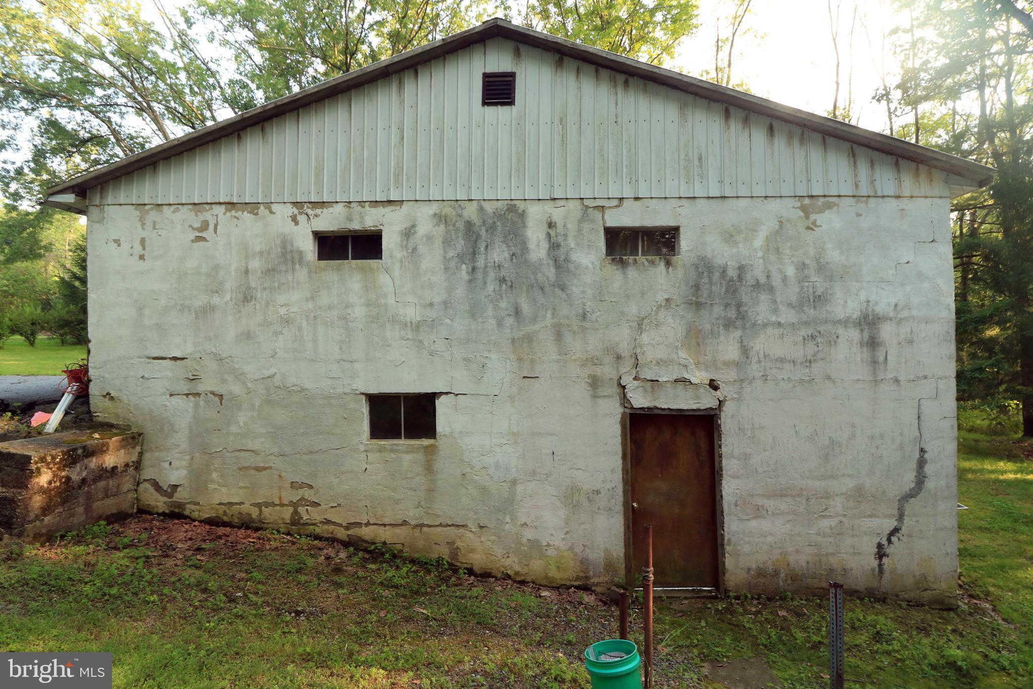 313 Greens Valley Road Centre Hall, PA 16828 - Photo 8 of 11 a side view of a wooden house