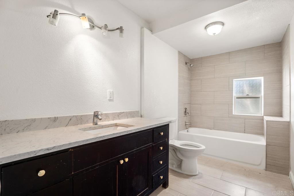 2758 Ribbonwood Road Boulevard, CA 91905 - Photo 15 of 38 a bathroom with a sink a toilet and shower