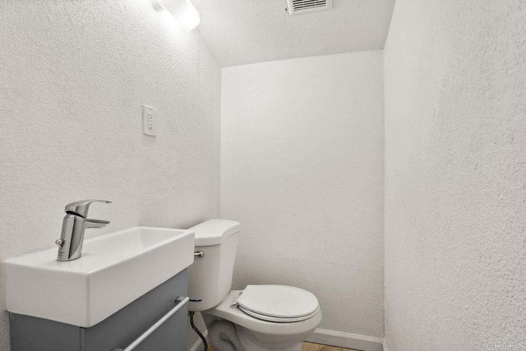 2758 Ribbonwood Road Boulevard, CA 91905 - Photo 18 of 38 a white toilet sitting next to a white sink