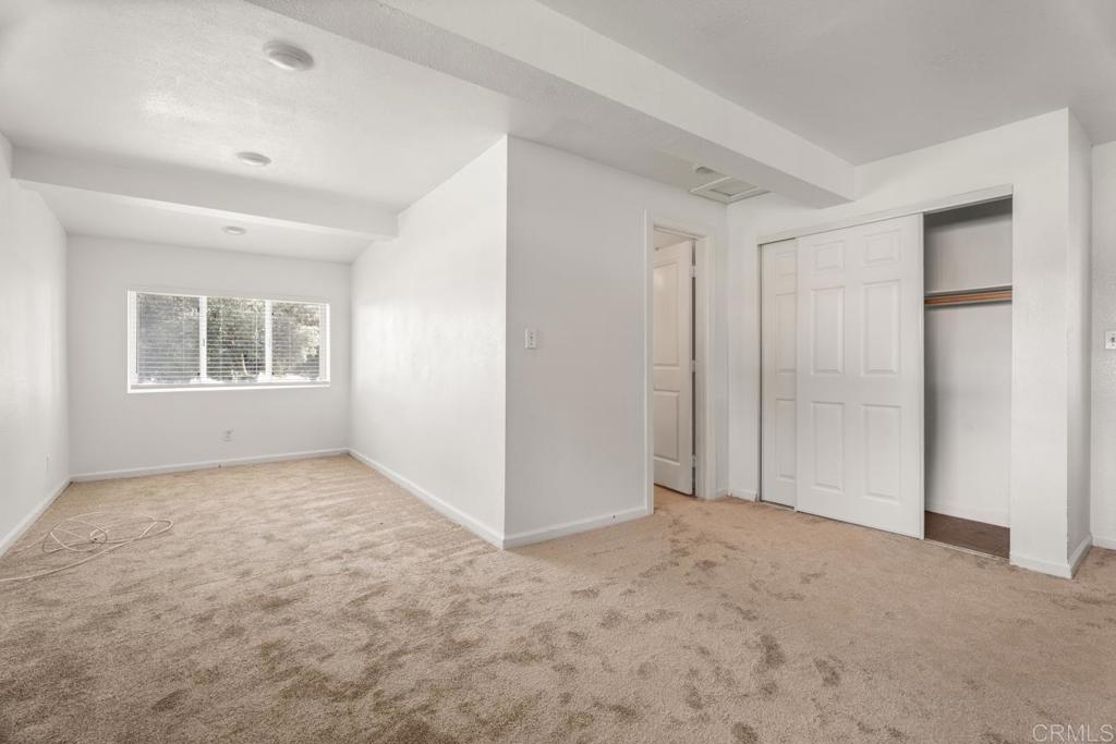 2758 Ribbonwood Road Boulevard, CA 91905 - Photo 20 of 38 a view of an empty room with a window