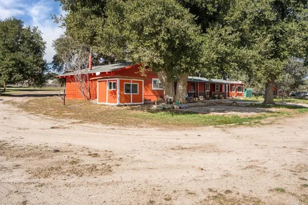 a backyard of a house with large trees