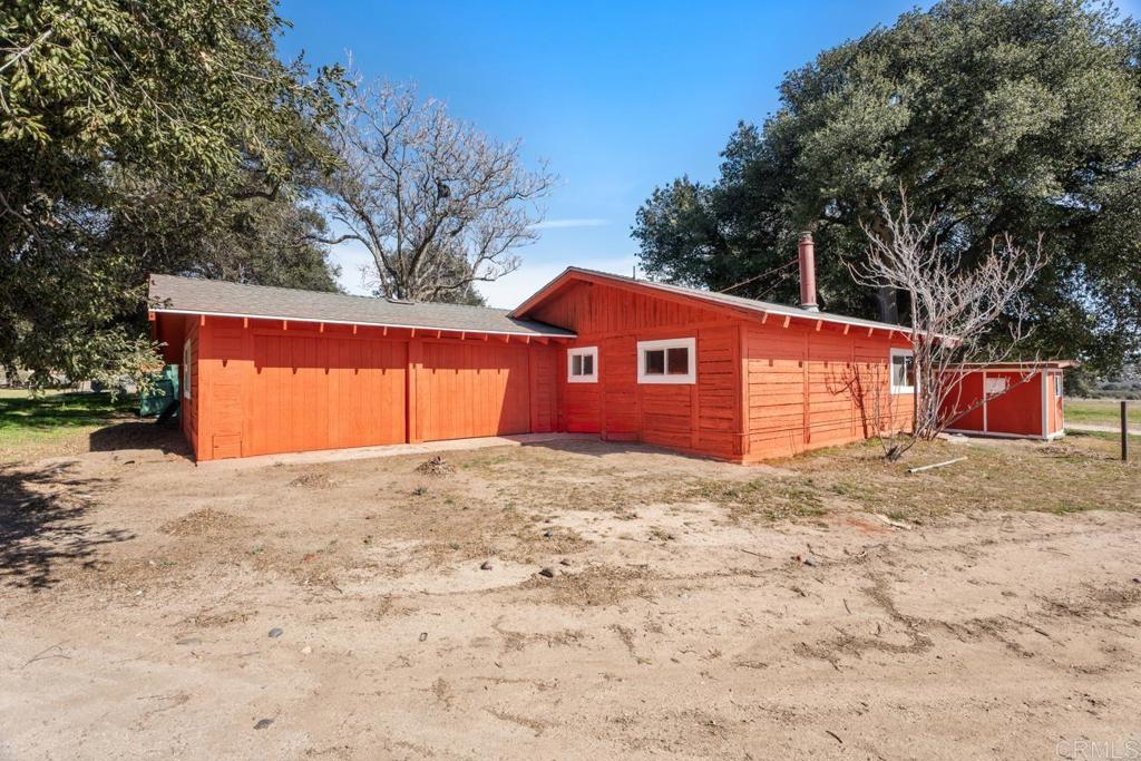2758 Ribbonwood Road Boulevard, CA 91905 - Photo 22 of 38 a backyard of a house with large trees