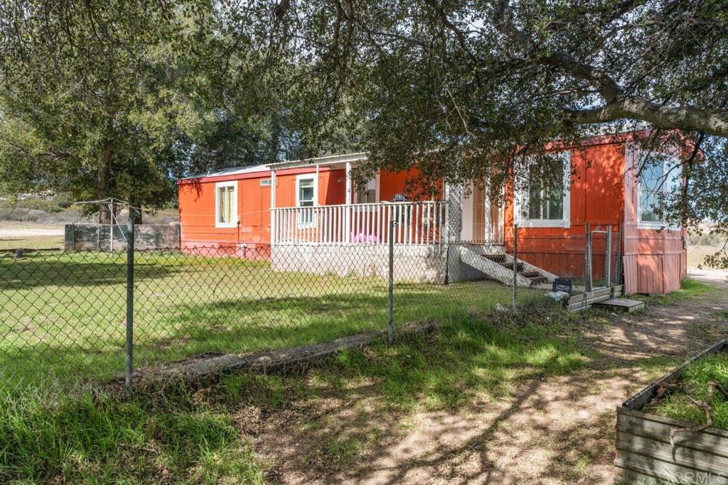 2758 Ribbonwood Road Boulevard, CA 91905 - Photo 24 of 38 a front view of a house with garden