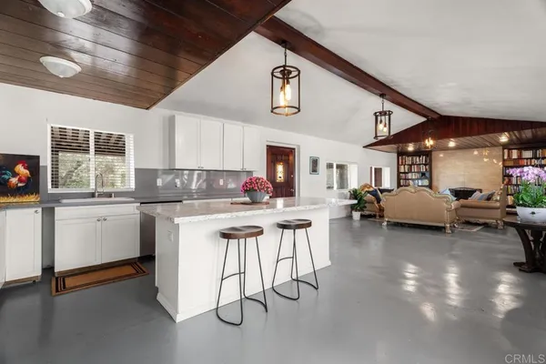 a kitchen with sink cabinets and window