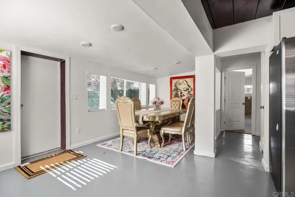 a work room with furniture and wooden floor